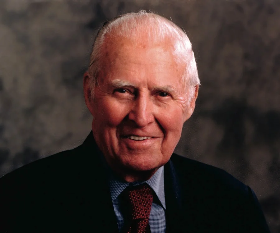 Portrait of Dr. Norman Borlaug smiling outdoors